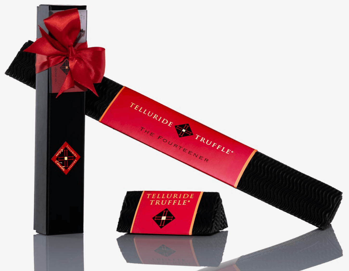 A black and red packaging box with a red ribbon.