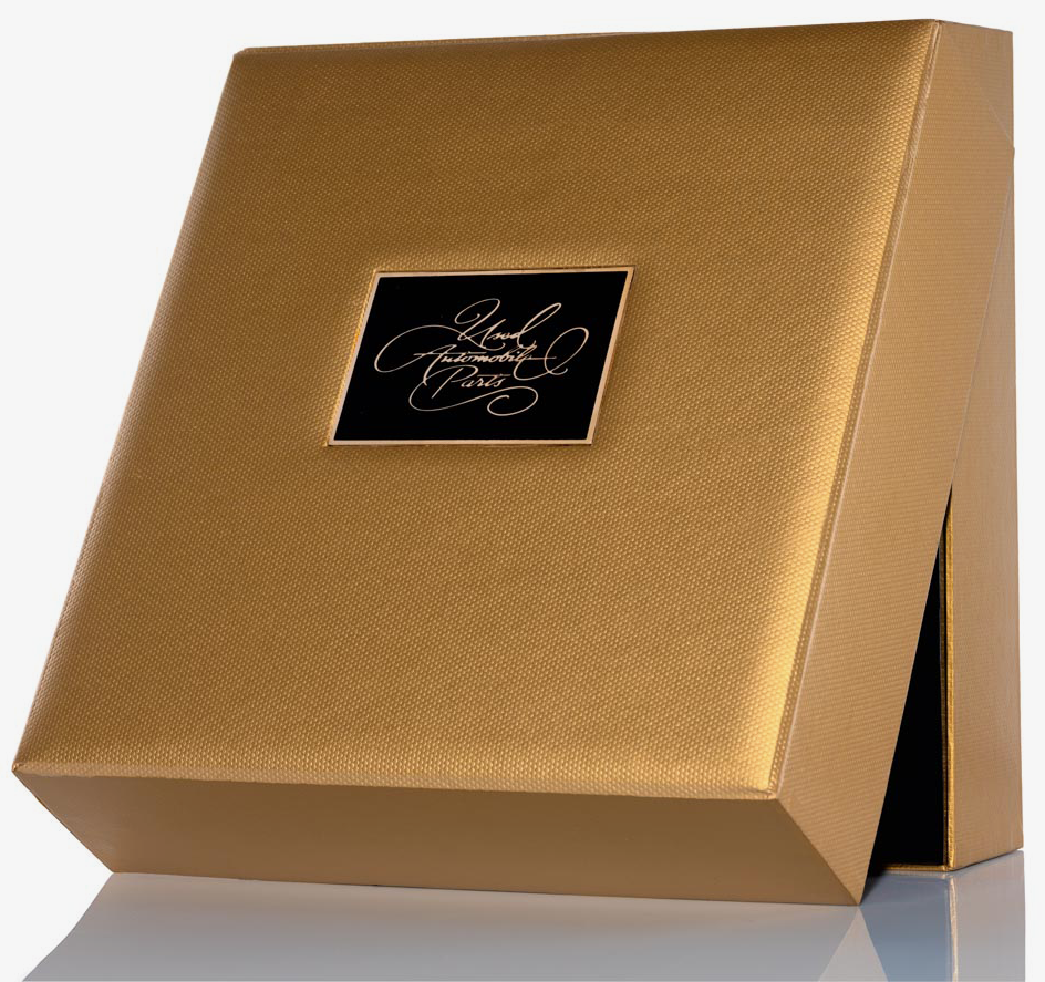 A gold box with a black label on it.